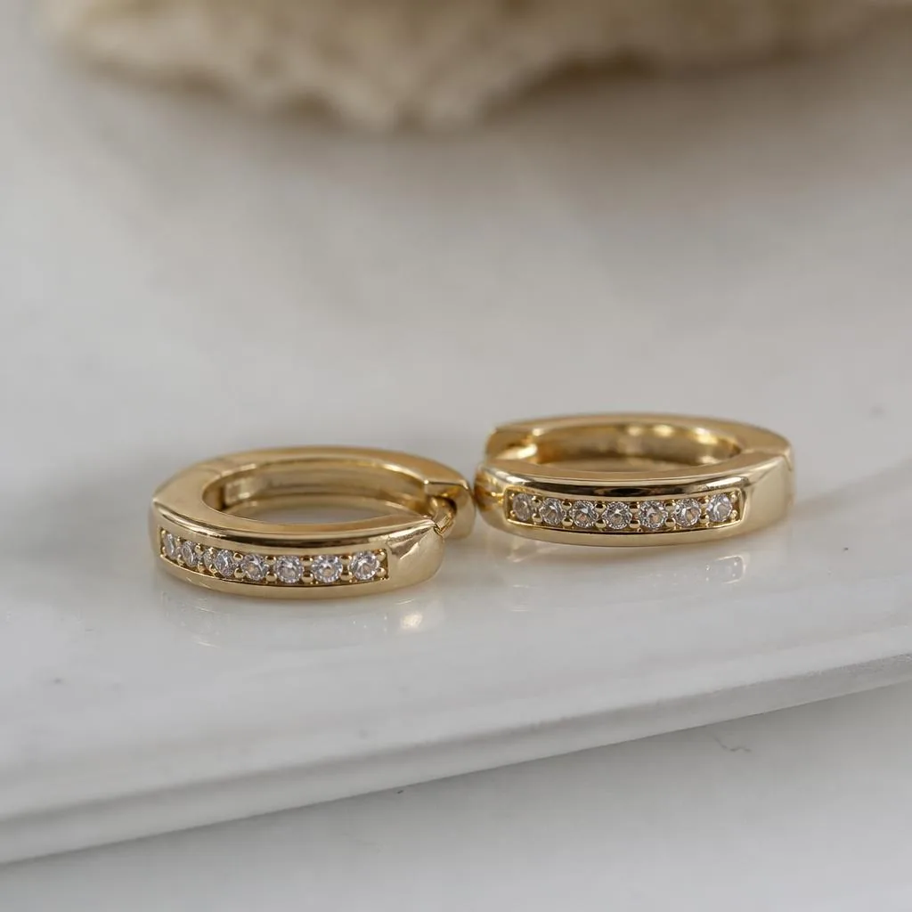 Diamond huggie hoop earrings in yellow gold